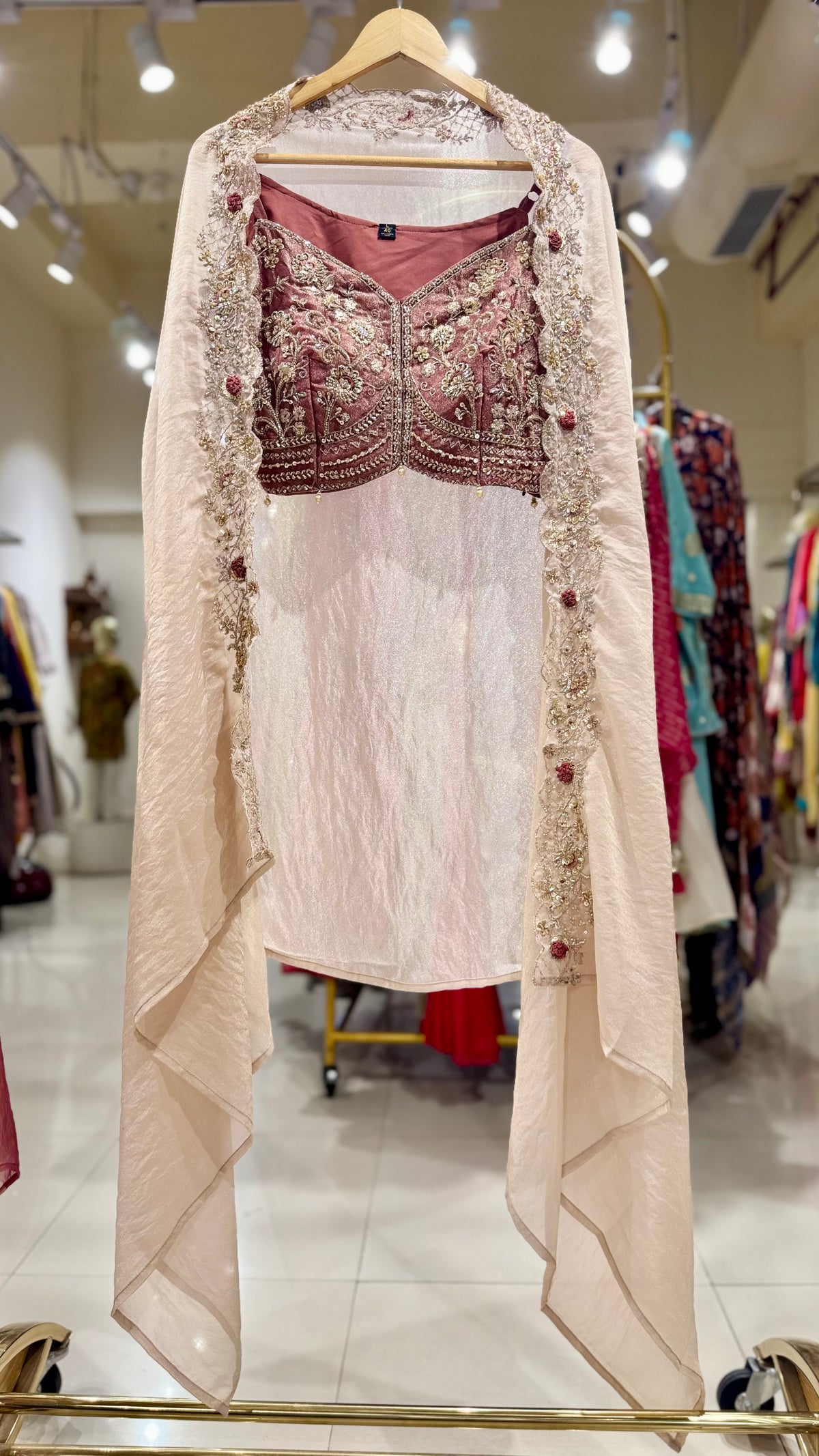 Off white cape and pink skirt top